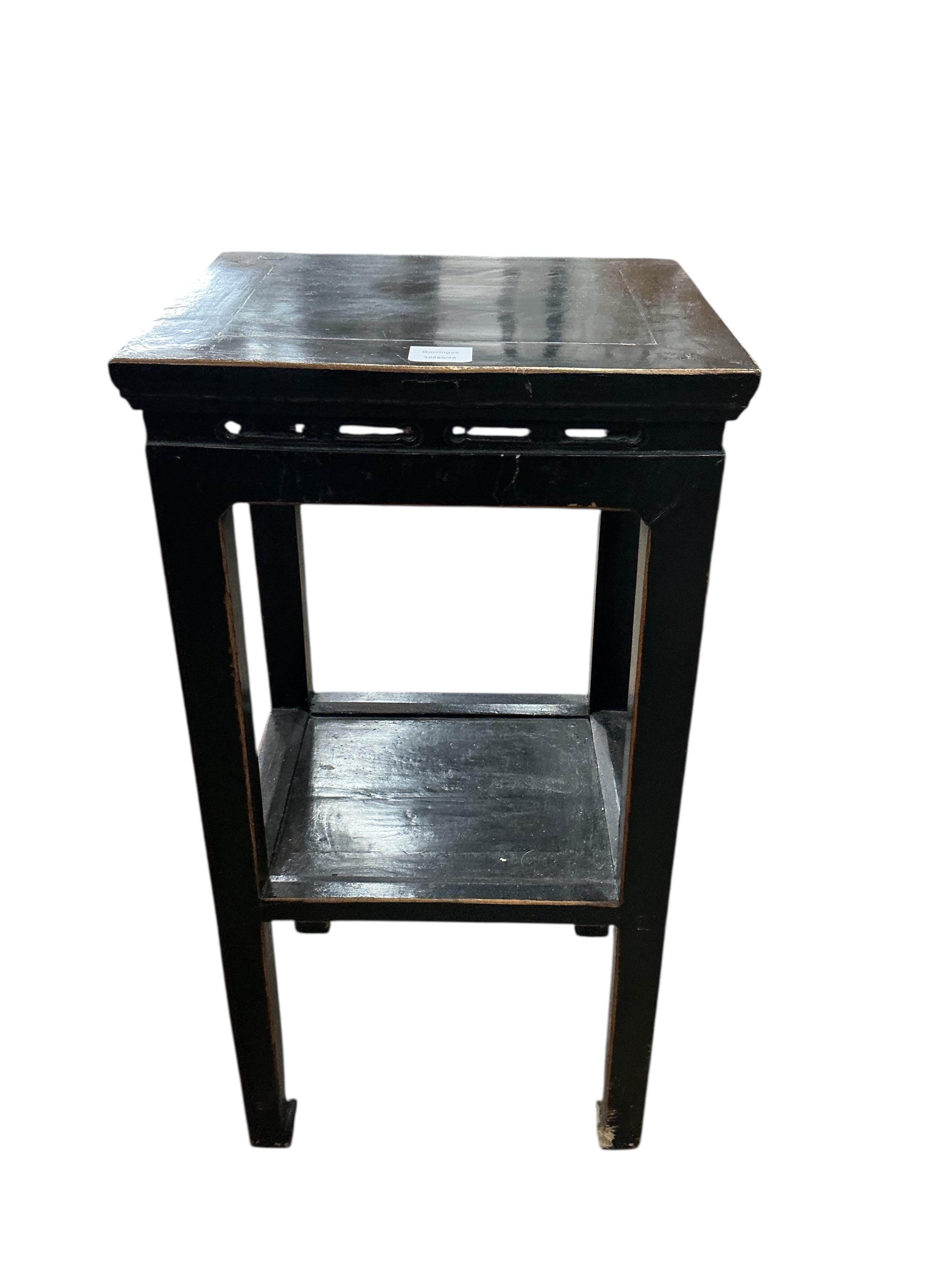 A pair of Chinese lacquer two tier tables, width 41cm, depth 34cm, height 79cm, Provenance: The late Kenneth Turner (1936-2025), celebrity florist, designer and perfume retailer, he received the Royal Warrant from the Pr